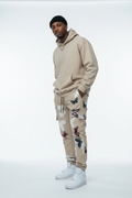 Male model in Stretch Butterfly Print Stacked Jeans - Beige